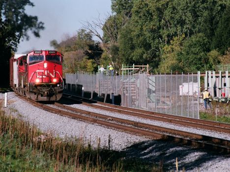 CN 2523 heads eastbound with a mixed freight at Farm Lane (construction) at East Lansing - 2008 [Douglas Thayer photo]